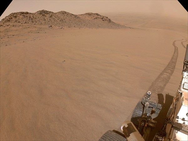 A sand slope with part of a robot vehicle is shown